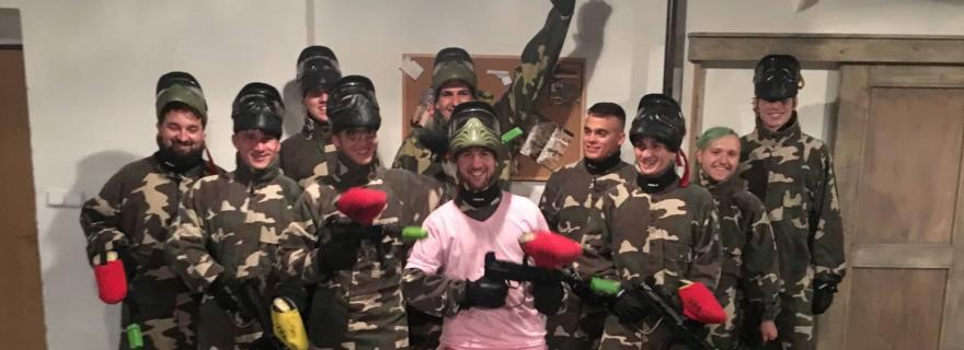 A bachelor party in overalls and with a rifle